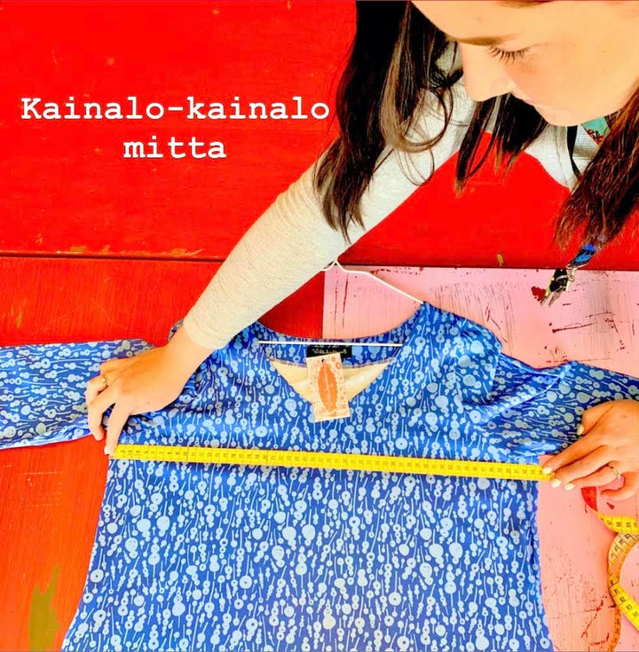 Kuvassa on opastettu, miten kainalosta kainalon mitta otetaan